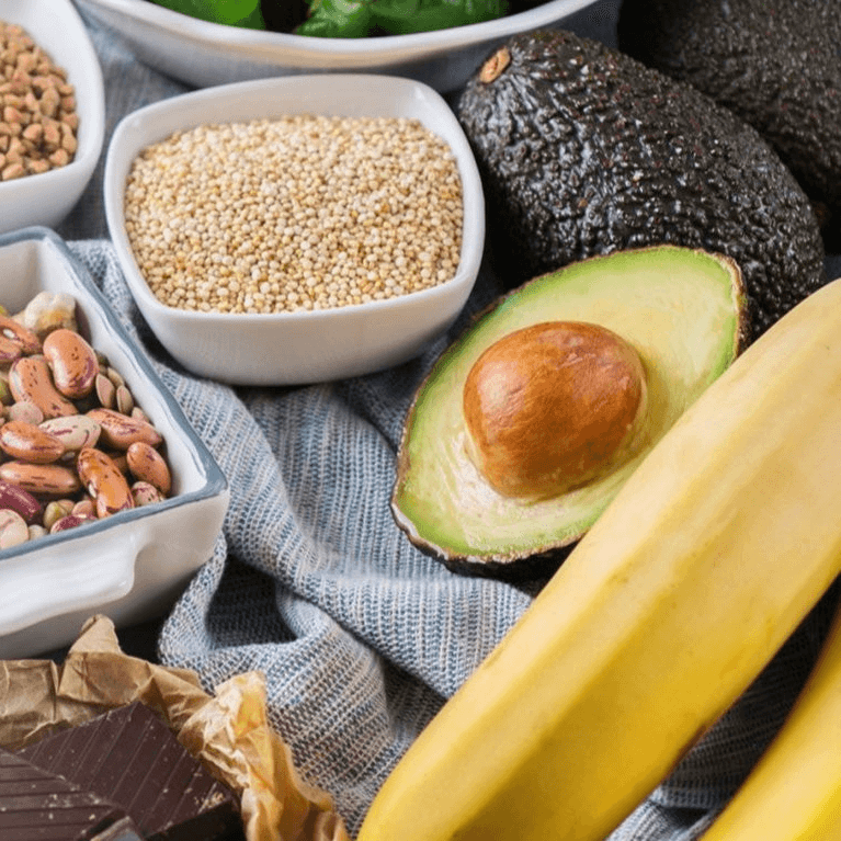 A selection of foods rich in magnesium, including grains, avocado and bananas