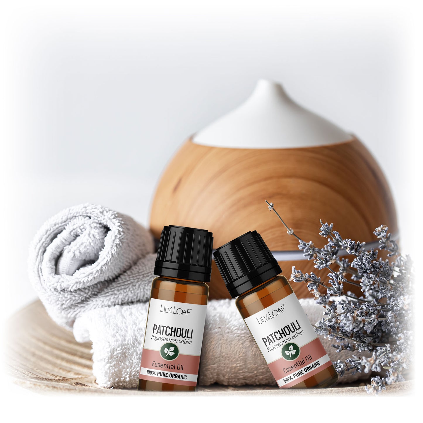 Lily & Loaf Organic Patchouli Essential Oil bottles with a diffuser