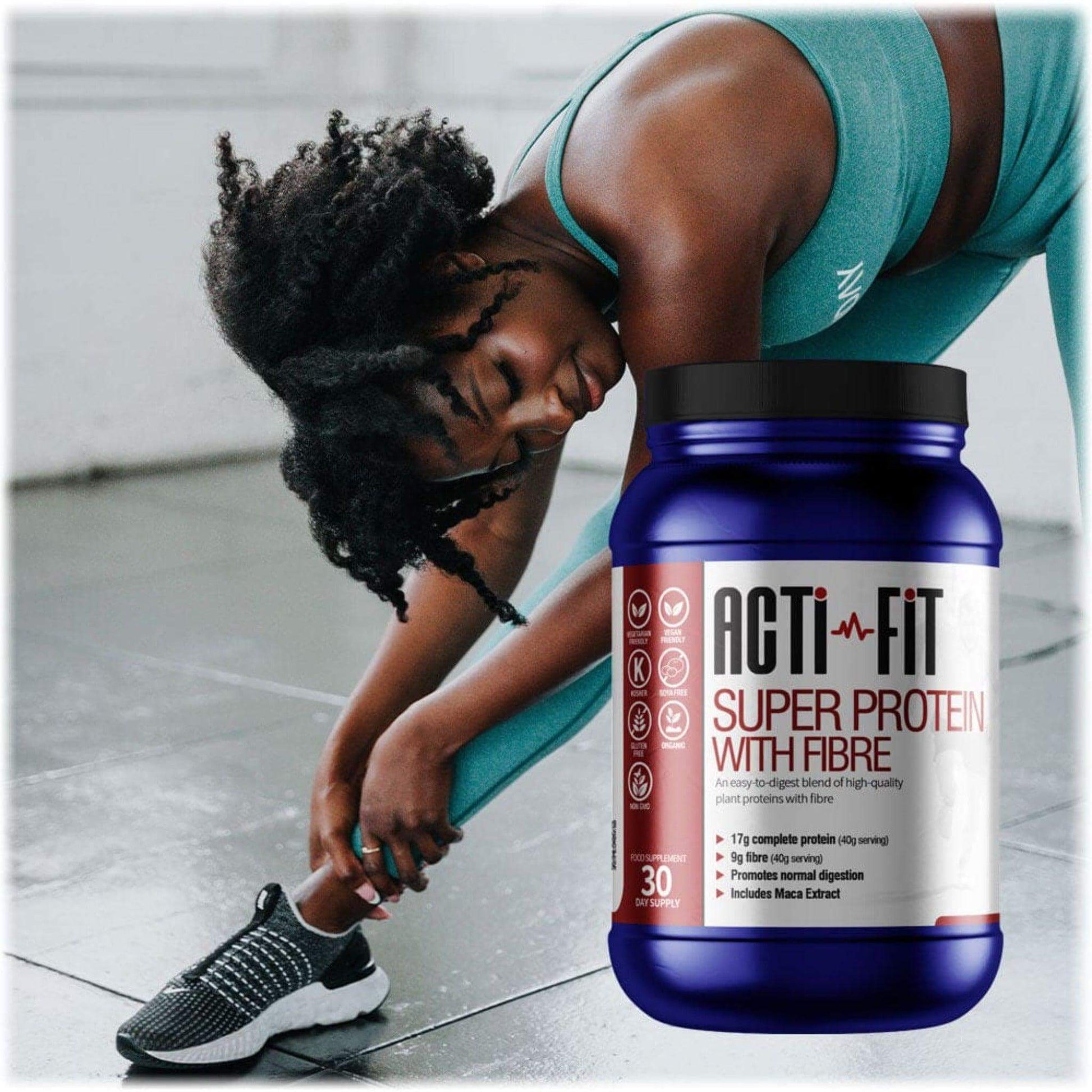A woman in workout clothes stretching her body with a tube of Super Protein with Fibre in the foreground